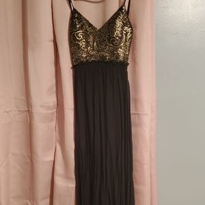 Night long dress with mini skirt inside and gold details.